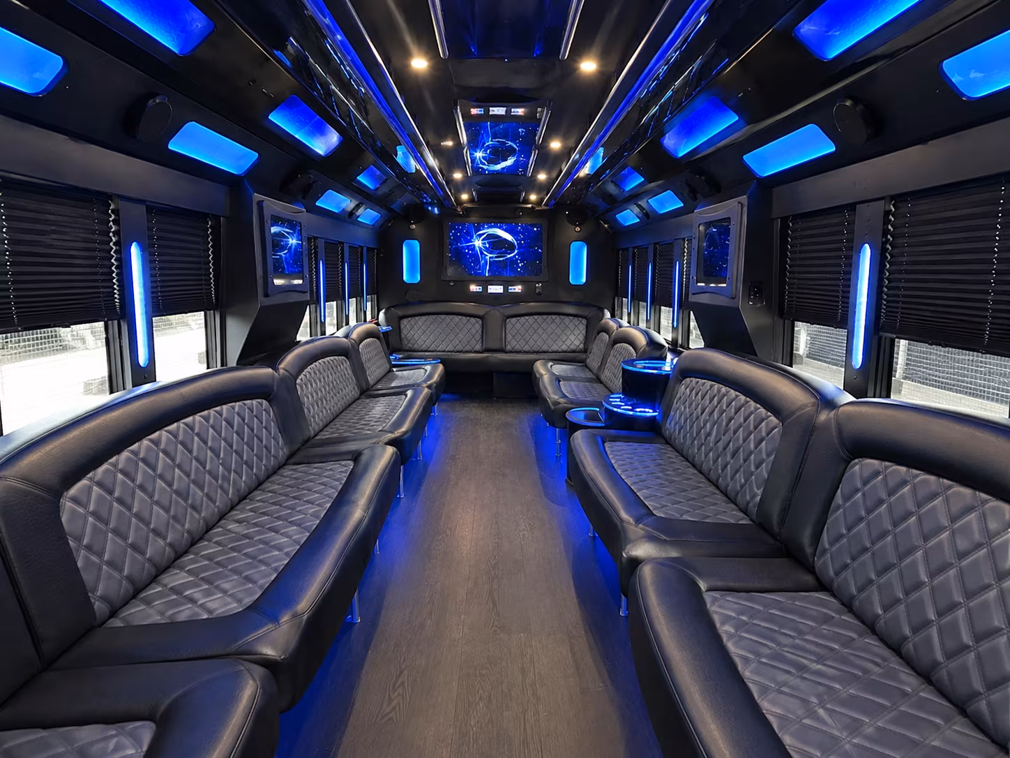 Friends laughing during a party bus celebration in Costa Mesa